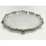 An ornate sterling silver salver by Mappin & Webb. Sheffield, 1933. 704 grams. 28cm