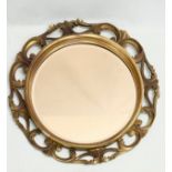 A vintage ornate gilt framed mirror. 65cm