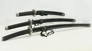 A set of 3 Samurai style swords. Largest 100cm