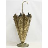 A large vintage brass umbrella stick stand with classical cherub decoration. 39x94cm