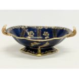 An early 20th century Crown Devon Fieldings gilt colt blue ‘Butterfly’ footed bowl. 32x21x11.5cm.