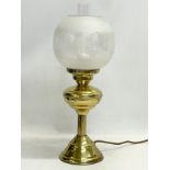 A vintage brass table lamp with etched glass shade. 51cm