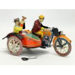 A vintage tinplate windup Paya motorcycle and sidecar. 18cm