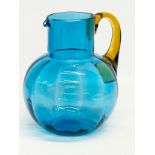 An early 20th century Art Glass jug with Amber Glass handle. Circa 1900-1920. 18x21cm