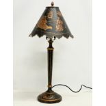 A tall Chinese style metal table lamp with chinoiserie decoration. 66cm