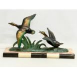 A 1920’s Art Deco spelter and marble figure of flying geese. 51x13.5x29cm
