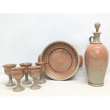 A vintage glazed pottery drinks set with dish.