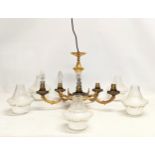 A vintage brass chandelier with 5 glass light shades. 45x54cm