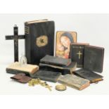A quantity of early 20th century religious items. Bibles, prayer books, a 19th century crucifix,