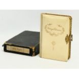 An early 20th century Orange Blossoms prayer book with faux ivory finish and gold leaf edge pages,
