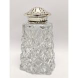 A silver top sugar shaker. 12cm