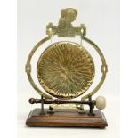 A vintage brass tabletop gong. 22x30cm