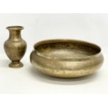 A large 19th century Middle Eastern brass bowl with a late 19th/early 20th century brass vase.