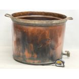 A very large late 19th century copper vat with brass tap. 67x57x43cm