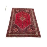 A large vintage Middle Eastern hand knotted rug. 312x210cm