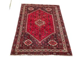 A large vintage Middle Eastern hand knotted rug. 312x210cm