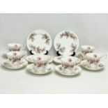 An 18 piece 1961 Royal Albert Lavender Rose tea set. 6 sandwich plates, 6 saucers and 6 cups.