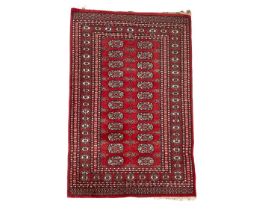 A vintage Middle Eastern hand knotted rug. 98x167cm
