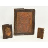 3 vintage embossed leather cases. A Gaelic leather folder 18x22.5cm. A leather card case and a
