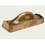 A Victorian bronze doorstop. 17x5x5cm