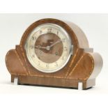 A good quality Art Deco inlaid walnut mantle clock with 2 chromed feet. With pendulum. 31x11x23cm