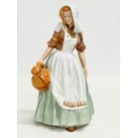A Royal Doulton ‘The Milkmaid’ figurine. HN 2057. Tableware LTD 1949. 17.5cm