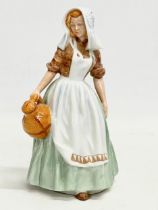 A Royal Doulton ‘The Milkmaid’ figurine. HN 2057. Tableware LTD 1949. 17.5cm