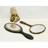 A Victorian faux tortoise shell hair comb and 2 vanity mirrors.