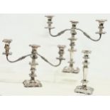 A pair of vintage silver plated candelabras and a matching candlestick. Largest 40x36cm.