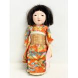 An early 20th century Japanese Ichimatsu Girl doll. 28cm