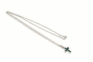 A silver necklace with silver cross pendant