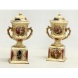 A pair of early 20th century ‘Royal Vienna’ porcelain urns. English made. 1920-1940. 10x21.5cm