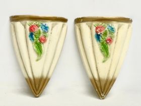 A pair of early to mid 20th century hand painted wall planters. 18x26cm