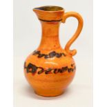 A Mid Century West German glazed pottery jug. 26cm