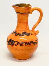 A Mid Century West German glazed pottery jug. 26cm