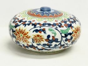 A large vintage Chinese pottery jar with lid. 25x15cm