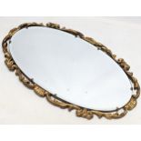 A vintage ornate gilt framed bevelled mirror. 66.5x 38.5cm