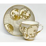 A rare late 19th century Royal Worcester gilt porcelain cup and saucer. Decorated with spiders,