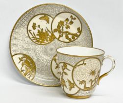 A rare late 19th century Royal Worcester gilt porcelain cup and saucer. Decorated with spiders,