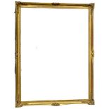 A large ornate gilt framed mirror. 105x136cm