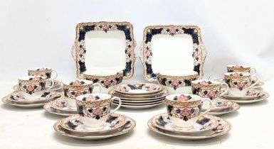 A vintage 34 piece Fenton tea set with 2 cake plates.