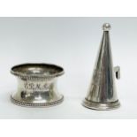 A silver Walker & Hall napkin ring and a sterling silver candle snuff.