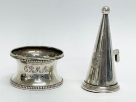 A silver Walker & Hall napkin ring and a sterling silver candle snuff.