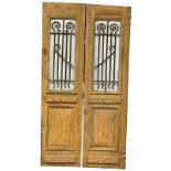 A pair of large 19th century French pine chateau doors with wrought iron Neo Gothic and glass