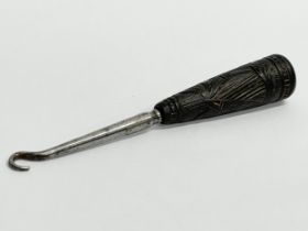 An Irish Bog Oak handled button hook. 10.5cm