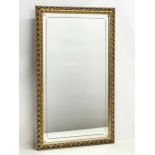 An ornate gilt framed mirror. 50x83cm