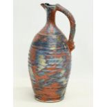 A tall Irish stoneware jug by Michael Kennedy Ceramics. 33cm