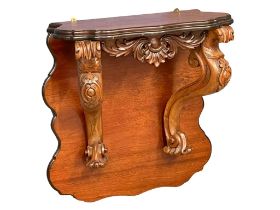 A large Victorian carved mahogany wall bracket. 71x33x75cm