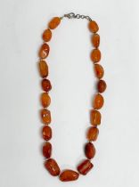 A vintage Amber necklace. 22cm closed.