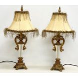 A pair of ornate gilt table lamps. 66cm